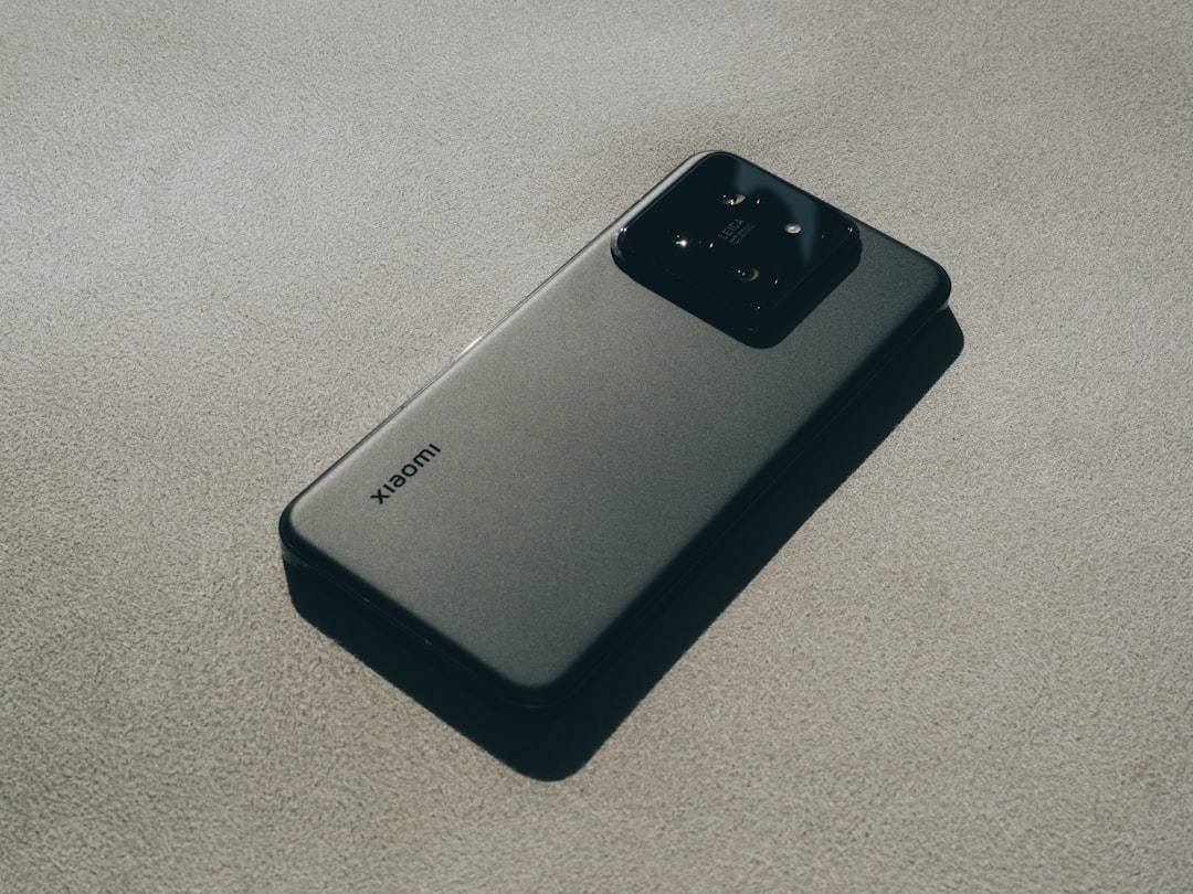 a close up of a cell phone on a surface